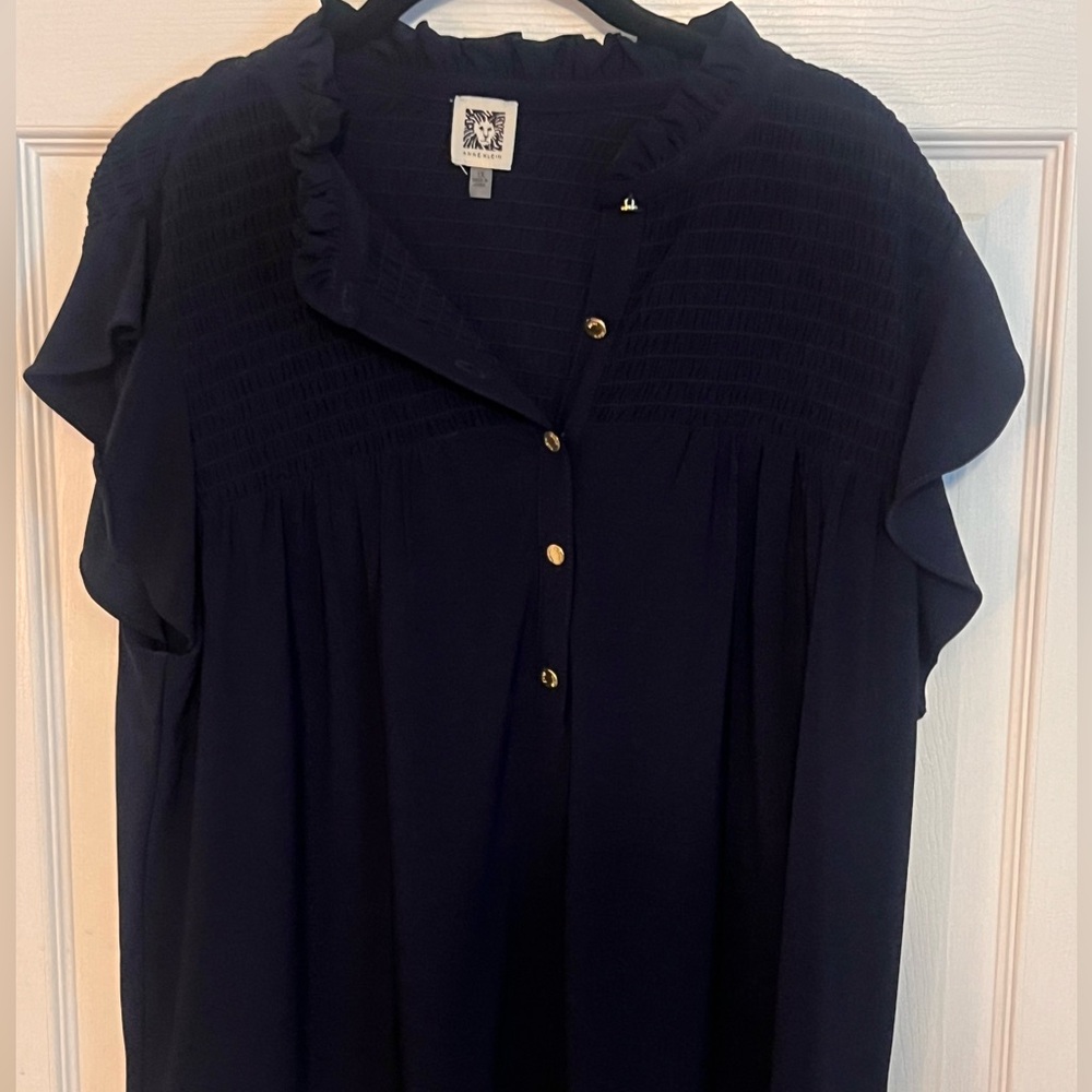 Navy blue top with gold buttons with cute neck and sleeve details